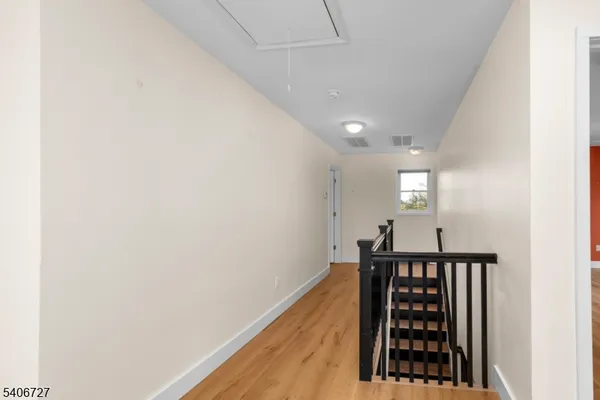 a view of entryway with wooden floor
