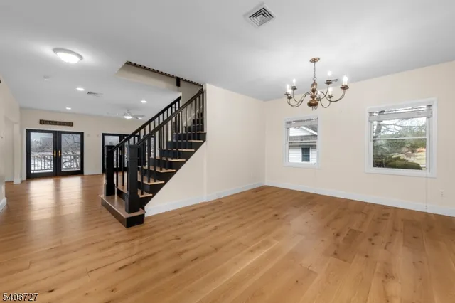 a view of an entryway with wooden floor