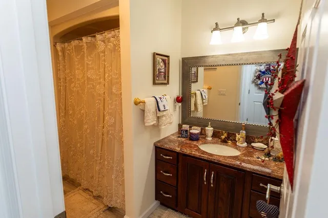 a bathroom with a sink and a mirror