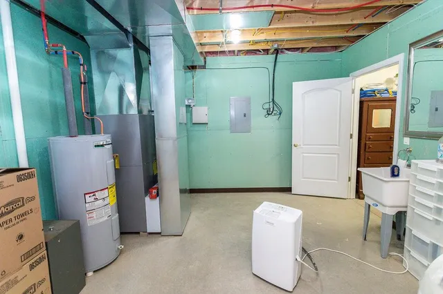 a room with refrigerator and washer