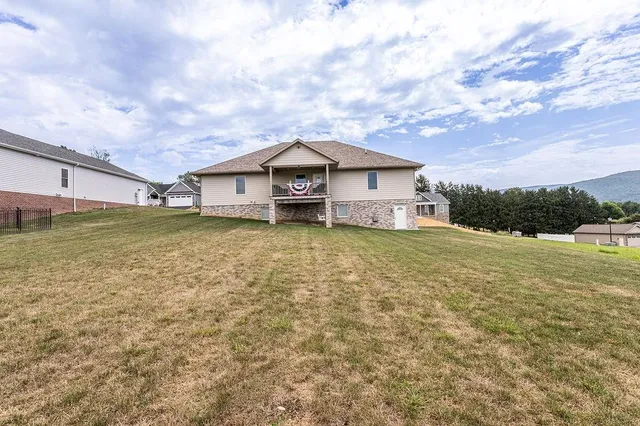 a big house with a big yard and large trees