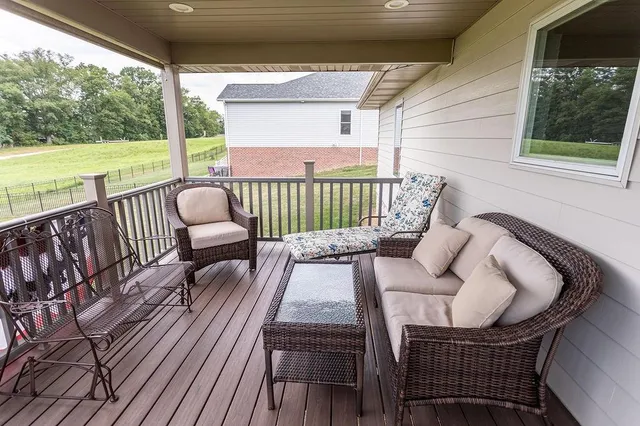 a view of balcony with furniture