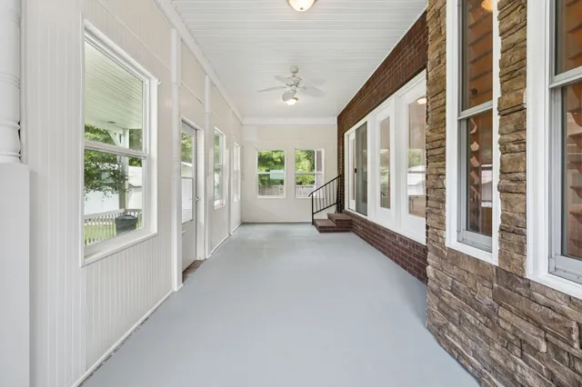a view of an entryway with wooden floor