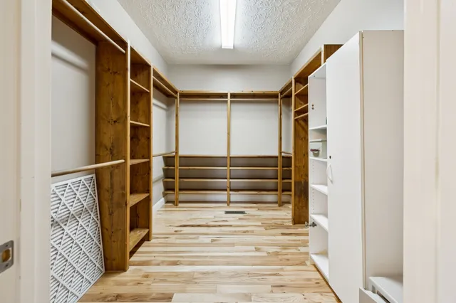 an empty room with a empty space and a ceiling fan