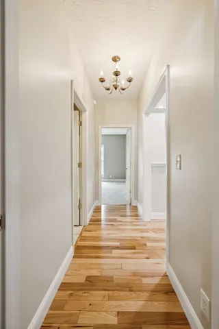 a bathroom with a granite countertop sink mirror and toilet