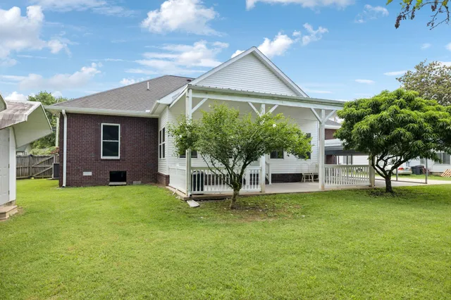 a view of a room with wooden walls