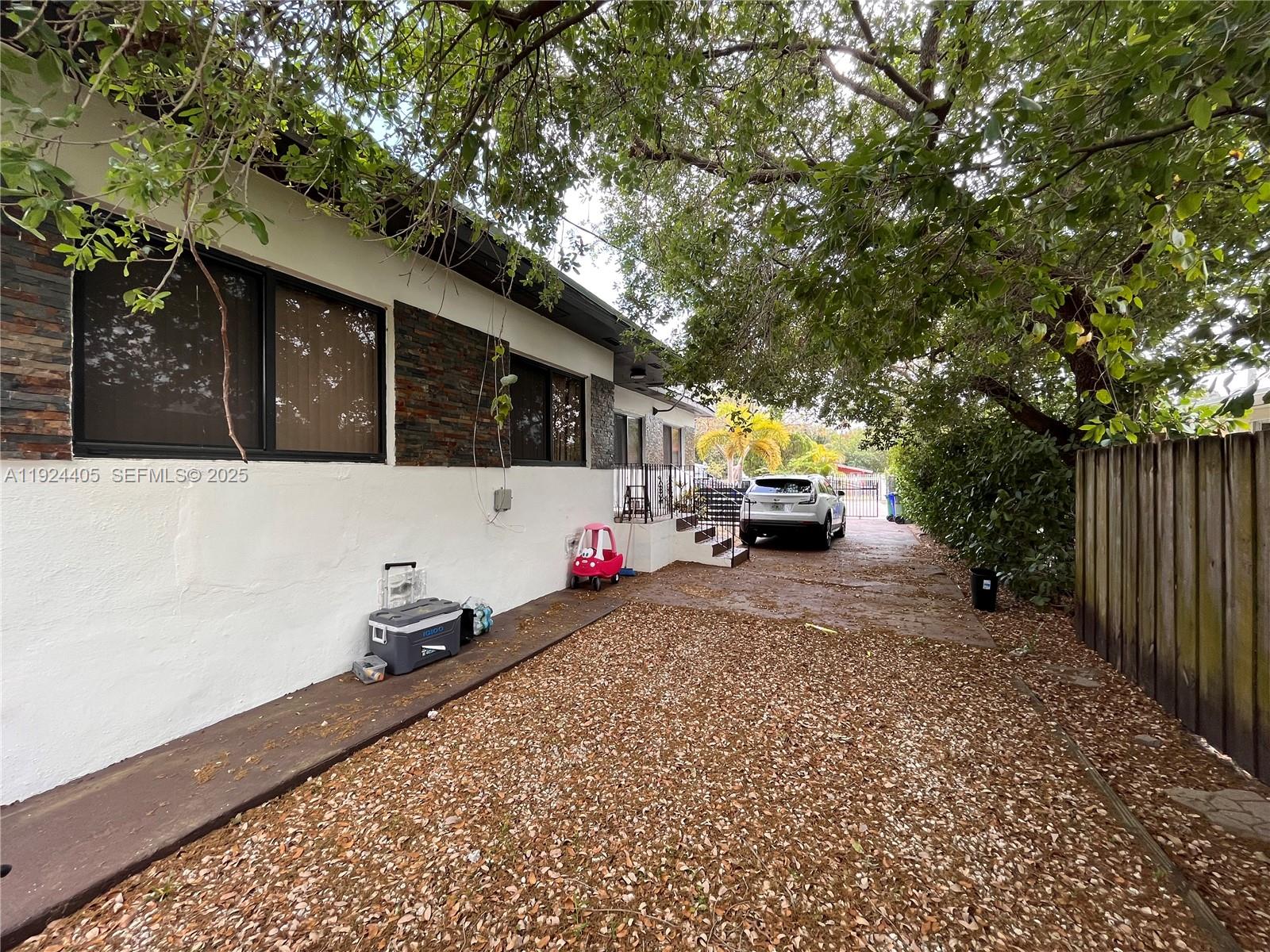 55 Northwest 44th Street Miami, FL 33127 - Photo 20 of 22 a front view of a house with trees