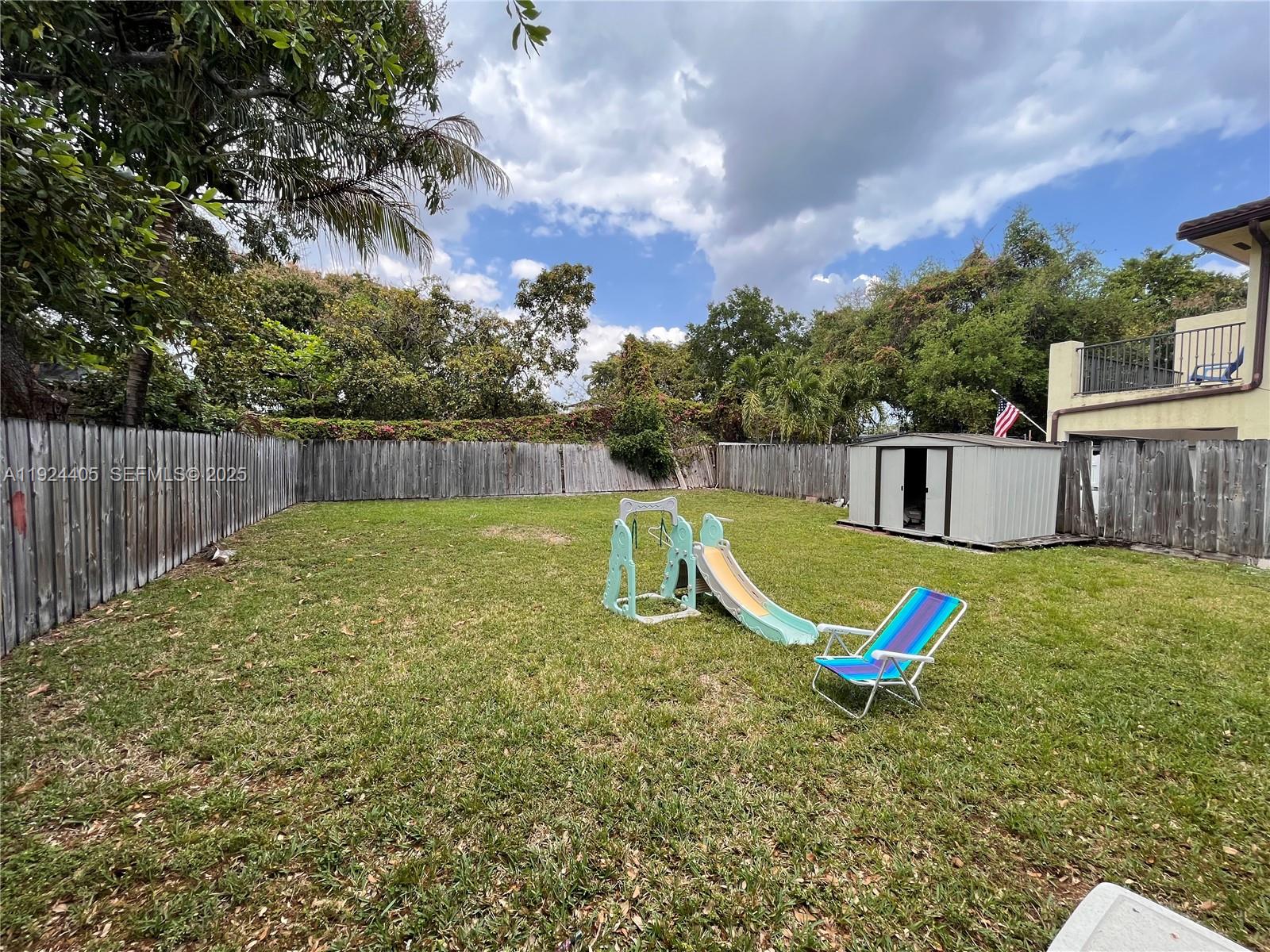 55 Northwest 44th Street Miami, FL 33127 - Photo 22 of 22 a swimming pool with some trees in the background