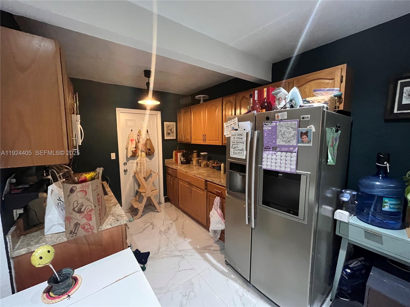 55 Northwest 44th Street Miami, FL 33127 - Photo 10 of 22 a kitchen with granite countertop lots of counter top space