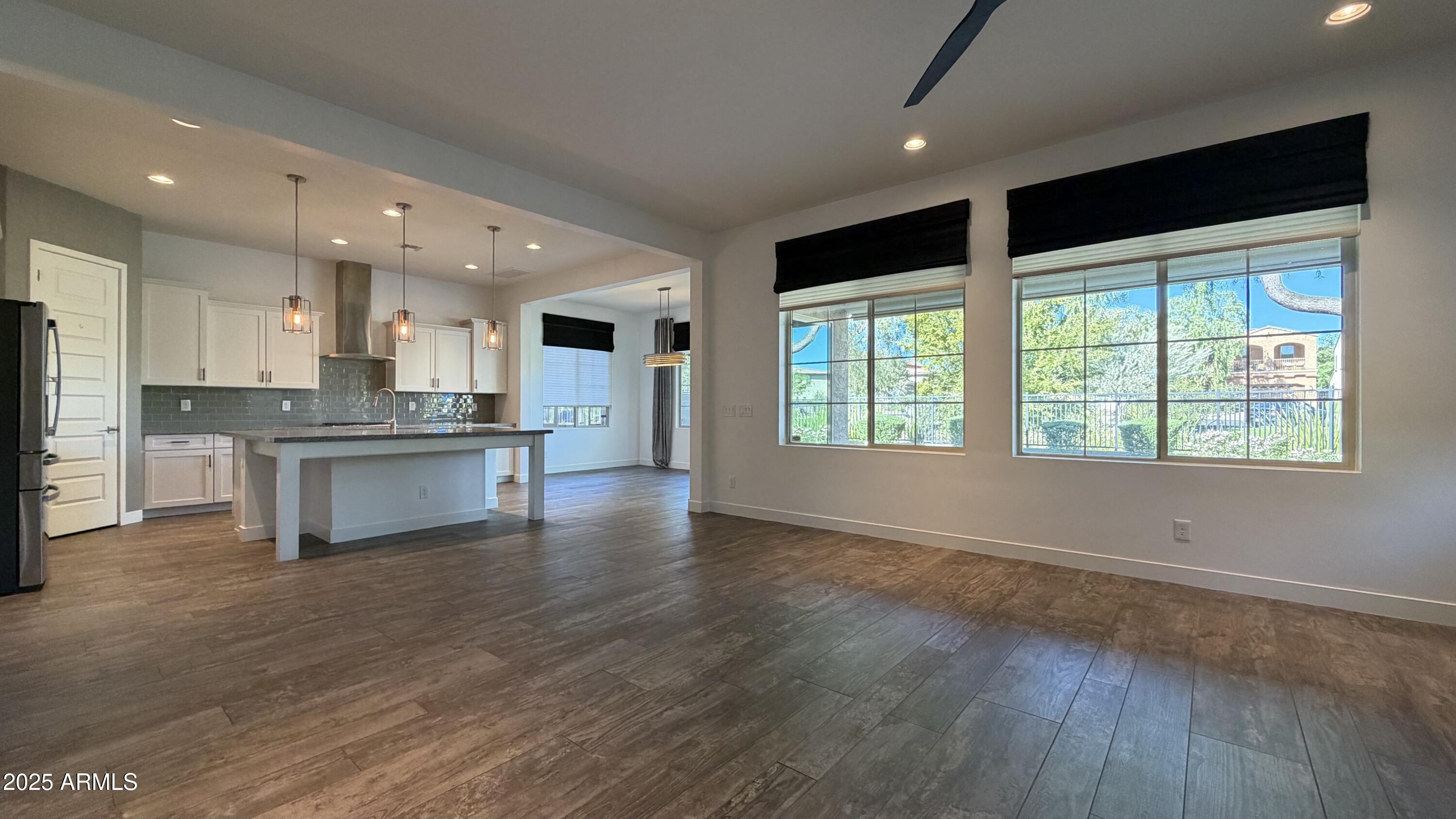 4536 East Walter Way Phoenix, AZ 85050 - Photo 13 of 50 a large kitchen with stainless steel appliances granite countertop a stove and a large window