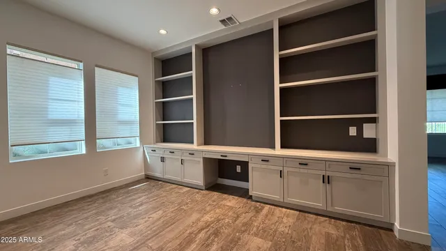 a kitchen with a cabinets and white stove