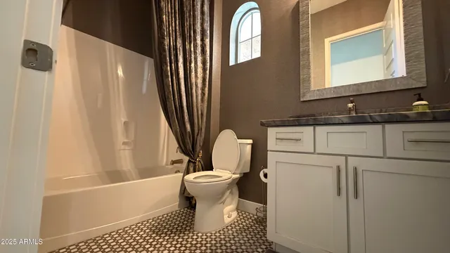 a bathroom with a sink a toilet and a bathtub