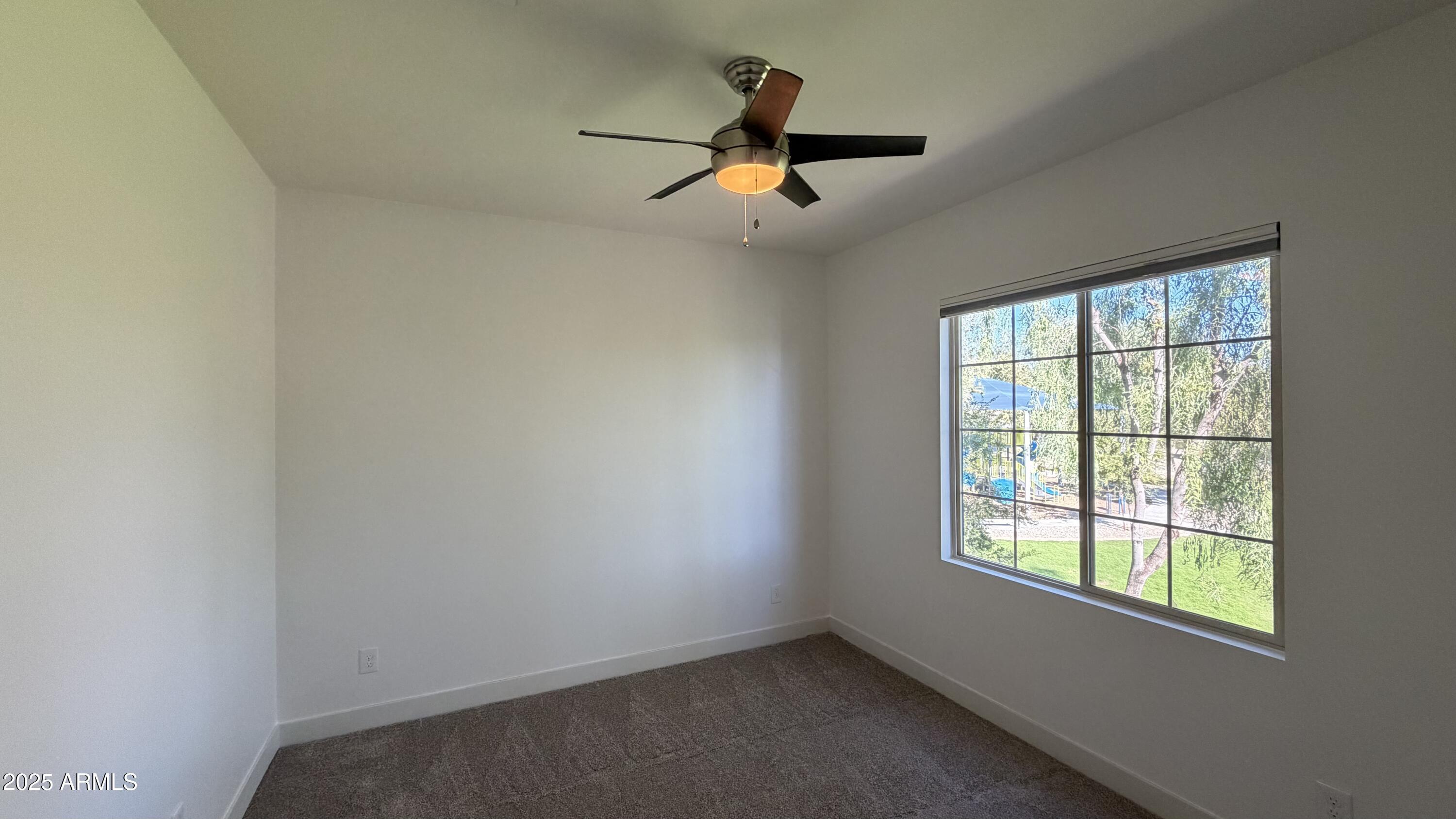 4536 East Walter Way Phoenix, AZ 85050 - Photo 36 of 50 an empty room with a window