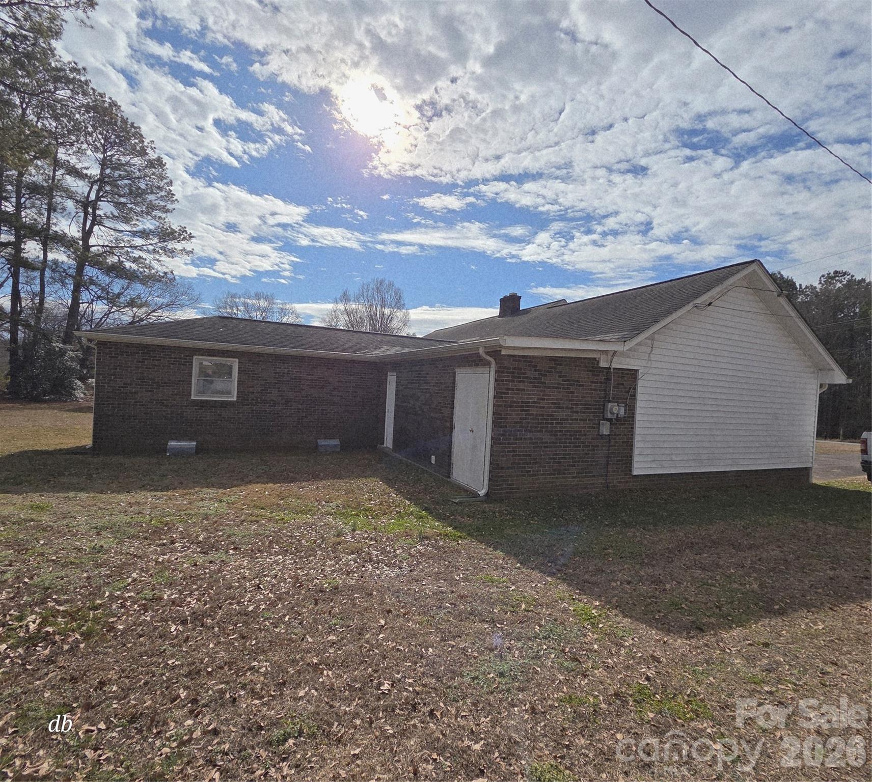 1133 Earl Road, Unit 7982 Shelby, NC 28152 - Photo 5 of 17 a view of a house with a yard and a garage