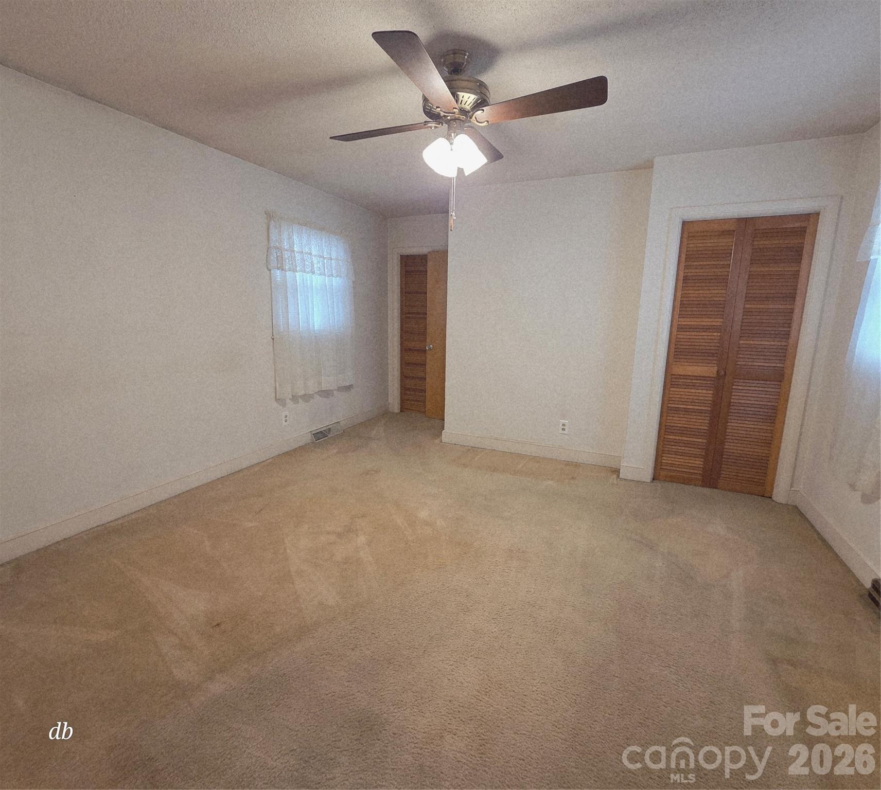 1133 Earl Road, Unit 7982 Shelby, NC 28152 - Photo 10 of 17 an empty room with closet and fan