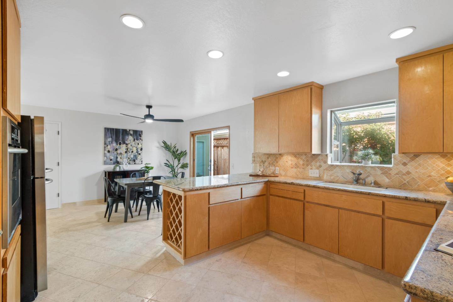 4770 Opal Street Capitola, CA 95010 - Photo 13 of 48 a large kitchen with a table and chairs