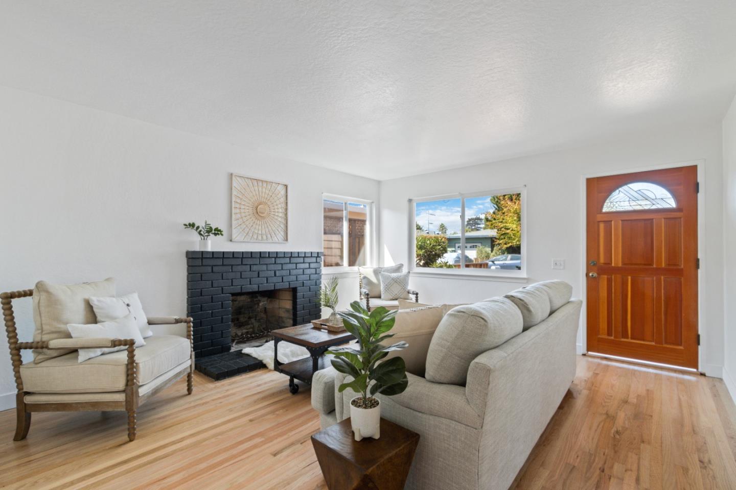 4770 Opal Street Capitola, CA 95010 - Photo 4 of 48 a living room with furniture and a fireplace