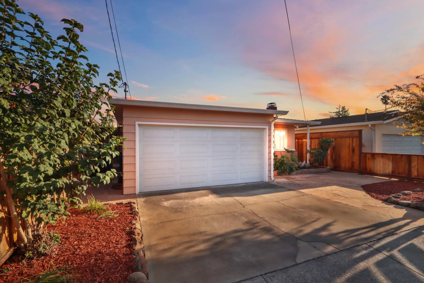 4770 Opal Street Capitola, CA 95010 - Photo 47 of 48 a front view of a house with a yard and garage