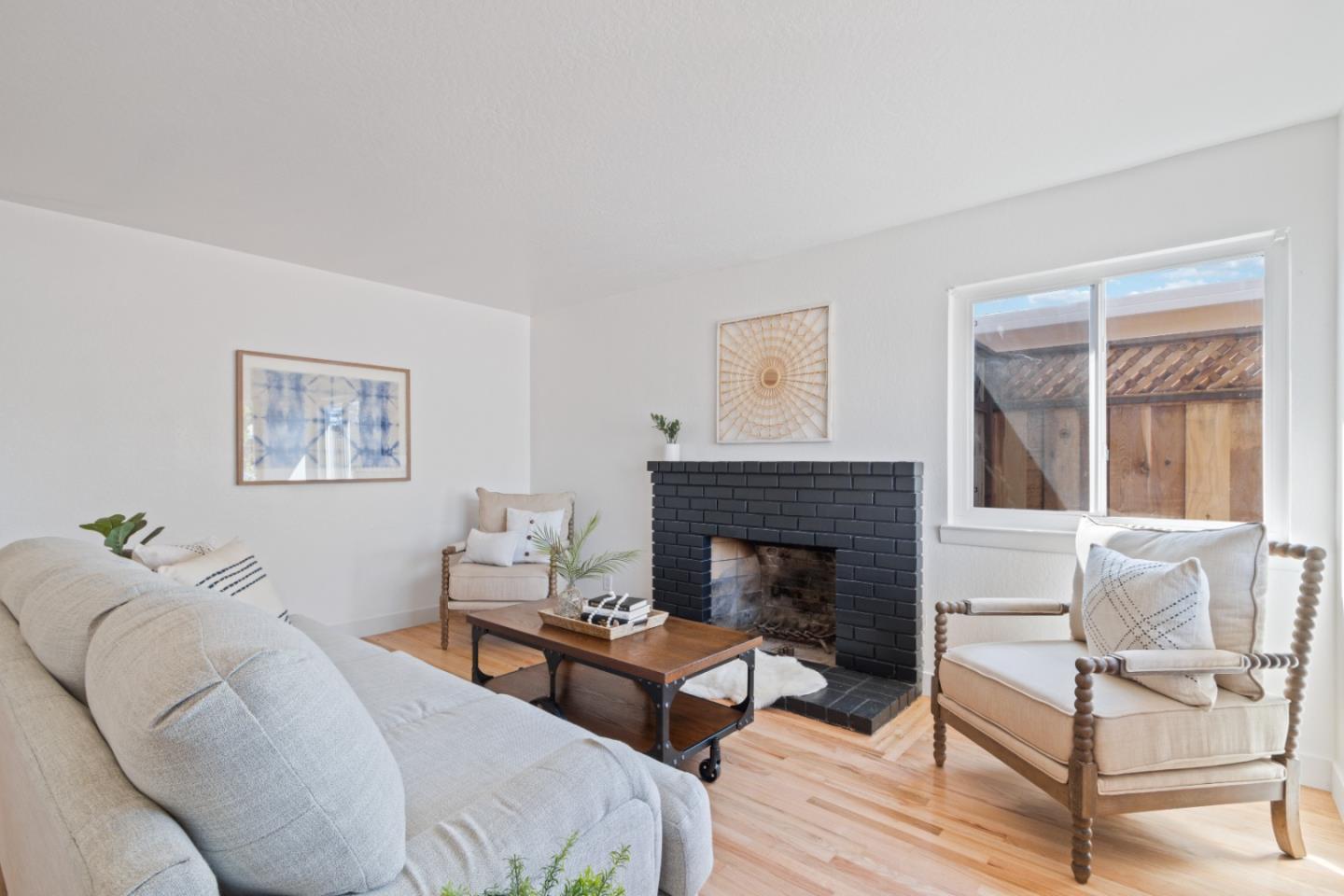 4770 Opal Street Capitola, CA 95010 - Photo 6 of 48 a living room with furniture and a fireplace