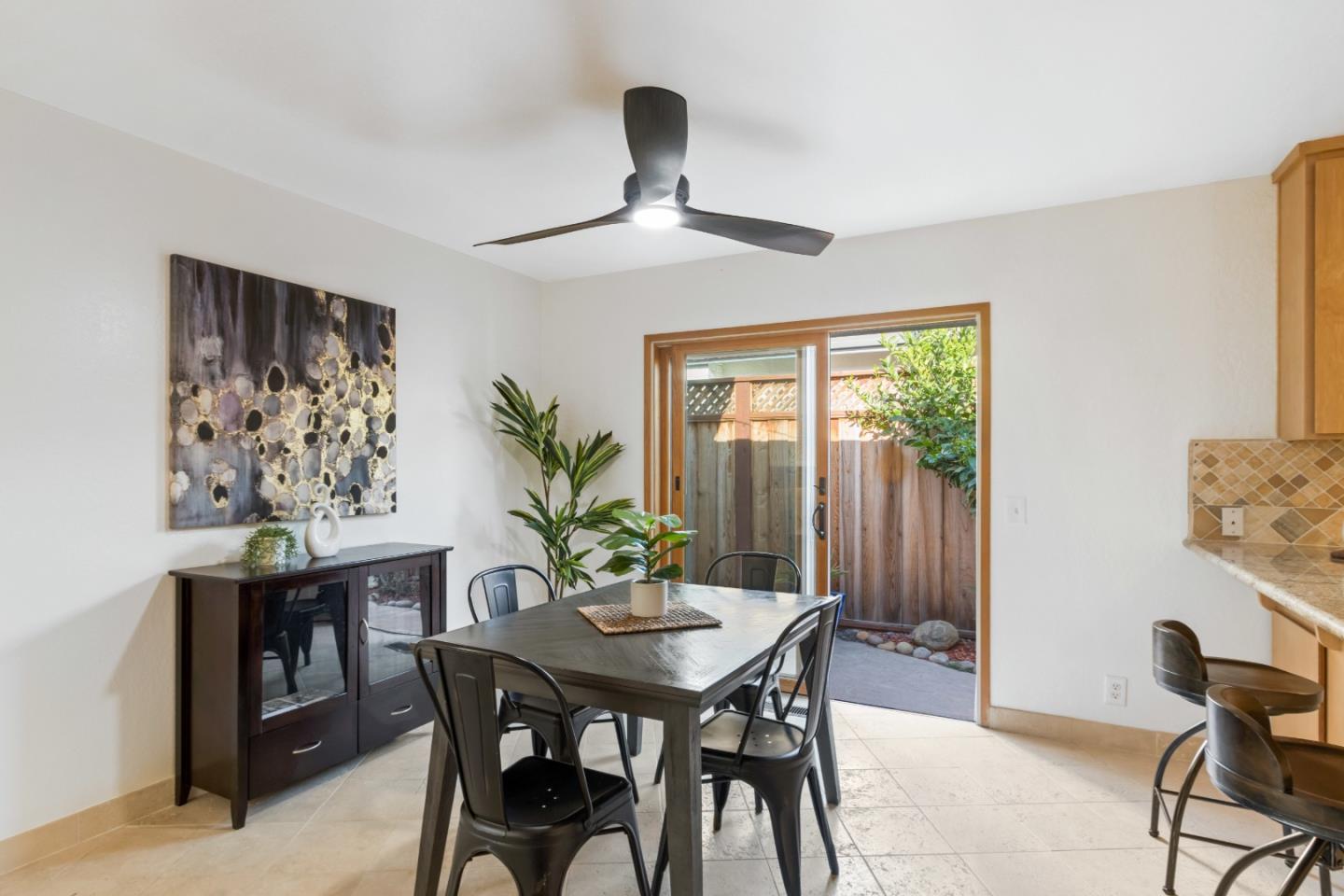 4770 Opal Street Capitola, CA 95010 - Photo 8 of 48 a view of a dining room with furniture and a large window