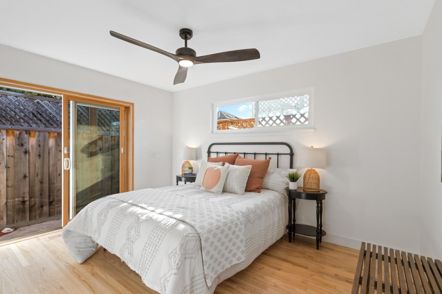 4770 Opal Street Capitola, CA 95010 - Photo 10 of 48 a bedroom with a bed and a ceiling fan