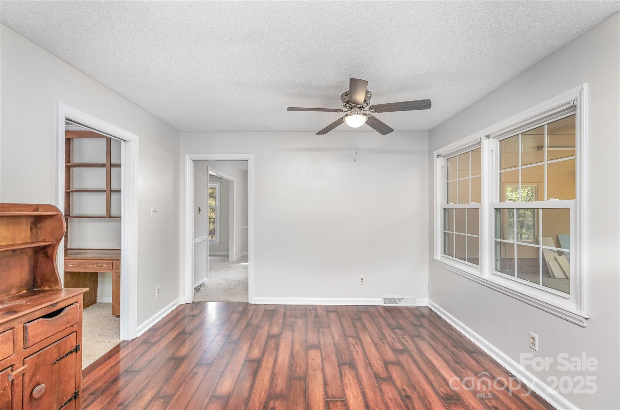 211 Ridgewood Drive Monroe, NC 28112 - Photo 12 of 31 wooden floor in an empty room with a window