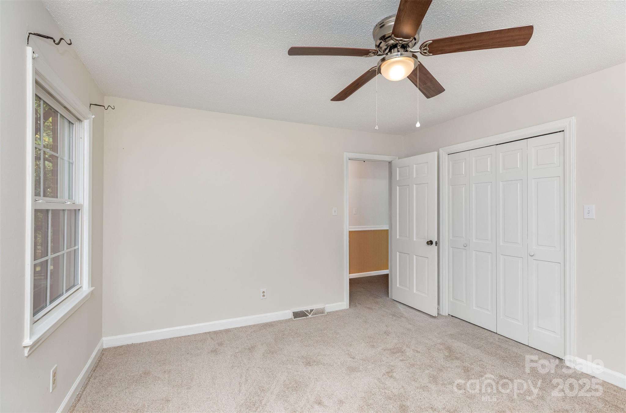 211 Ridgewood Drive Monroe, NC 28112 - Photo 17 of 31 a view of an empty room with a window