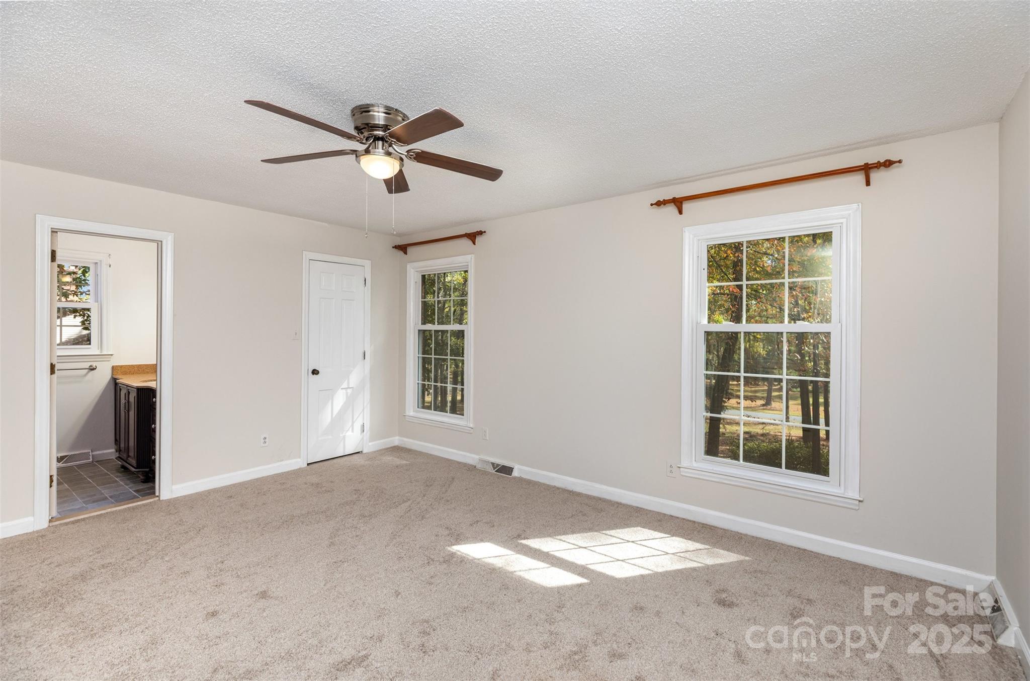 211 Ridgewood Drive Monroe, NC 28112 - Photo 20 of 31 a view of a livingroom with a ceiling fan and window