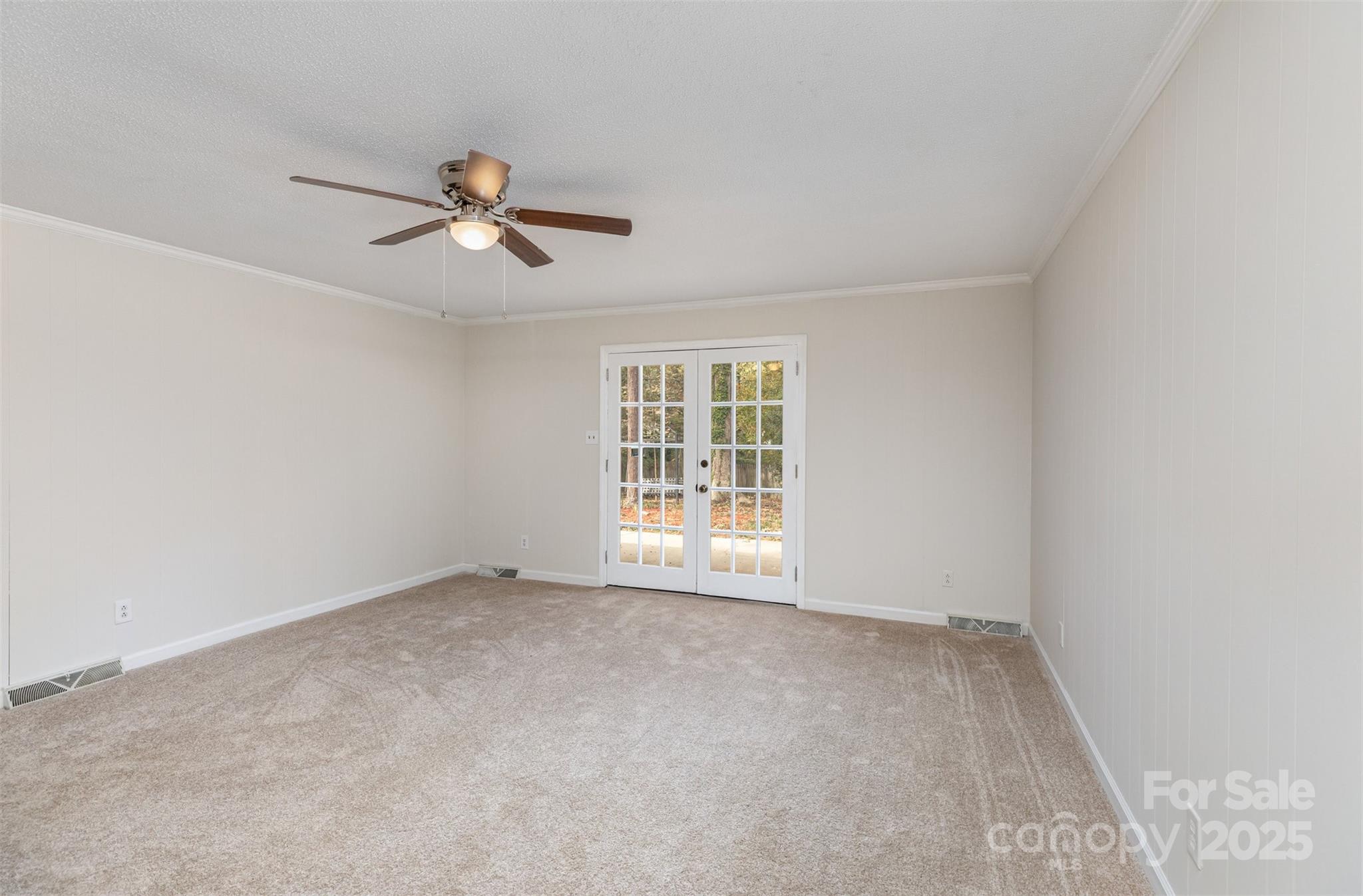 211 Ridgewood Drive Monroe, NC 28112 - Photo 24 of 31 an empty room with windows and fan