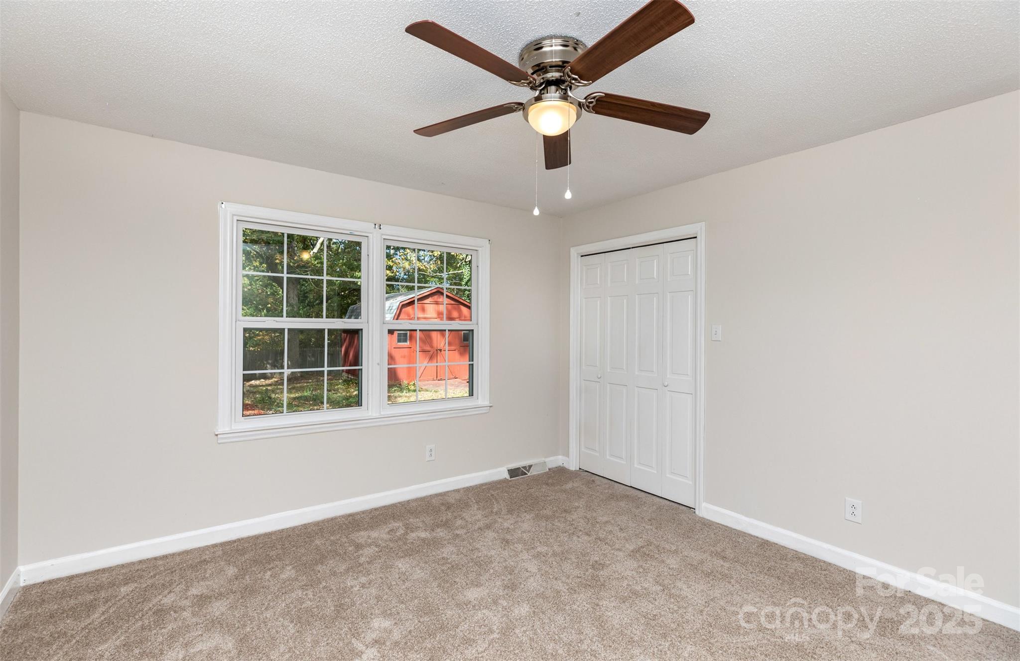 211 Ridgewood Drive Monroe, NC 28112 - Photo 26 of 31 an empty room with a window