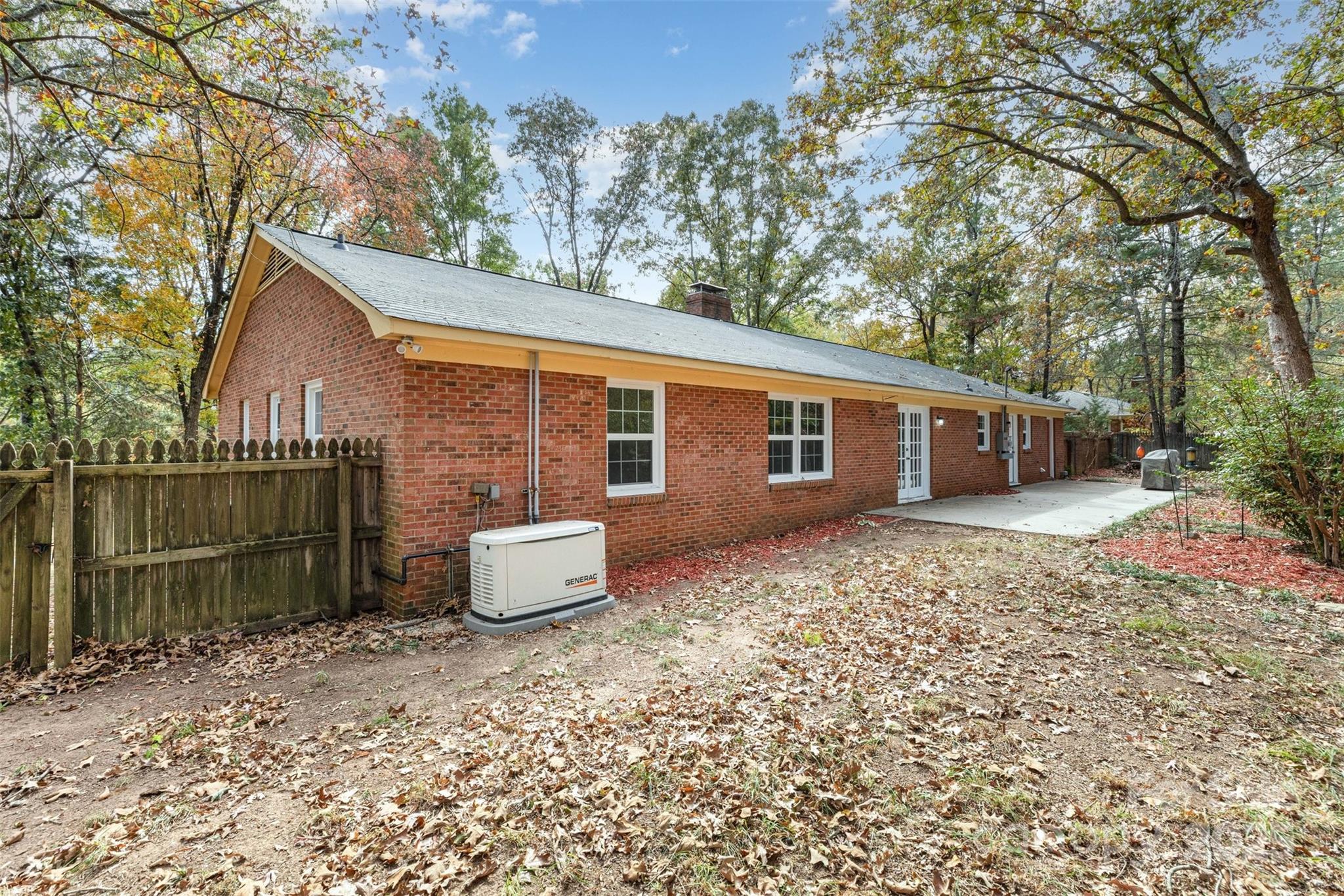 211 Ridgewood Drive Monroe, NC 28112 - Photo 29 of 31 a backyard of a house with table and chairs
