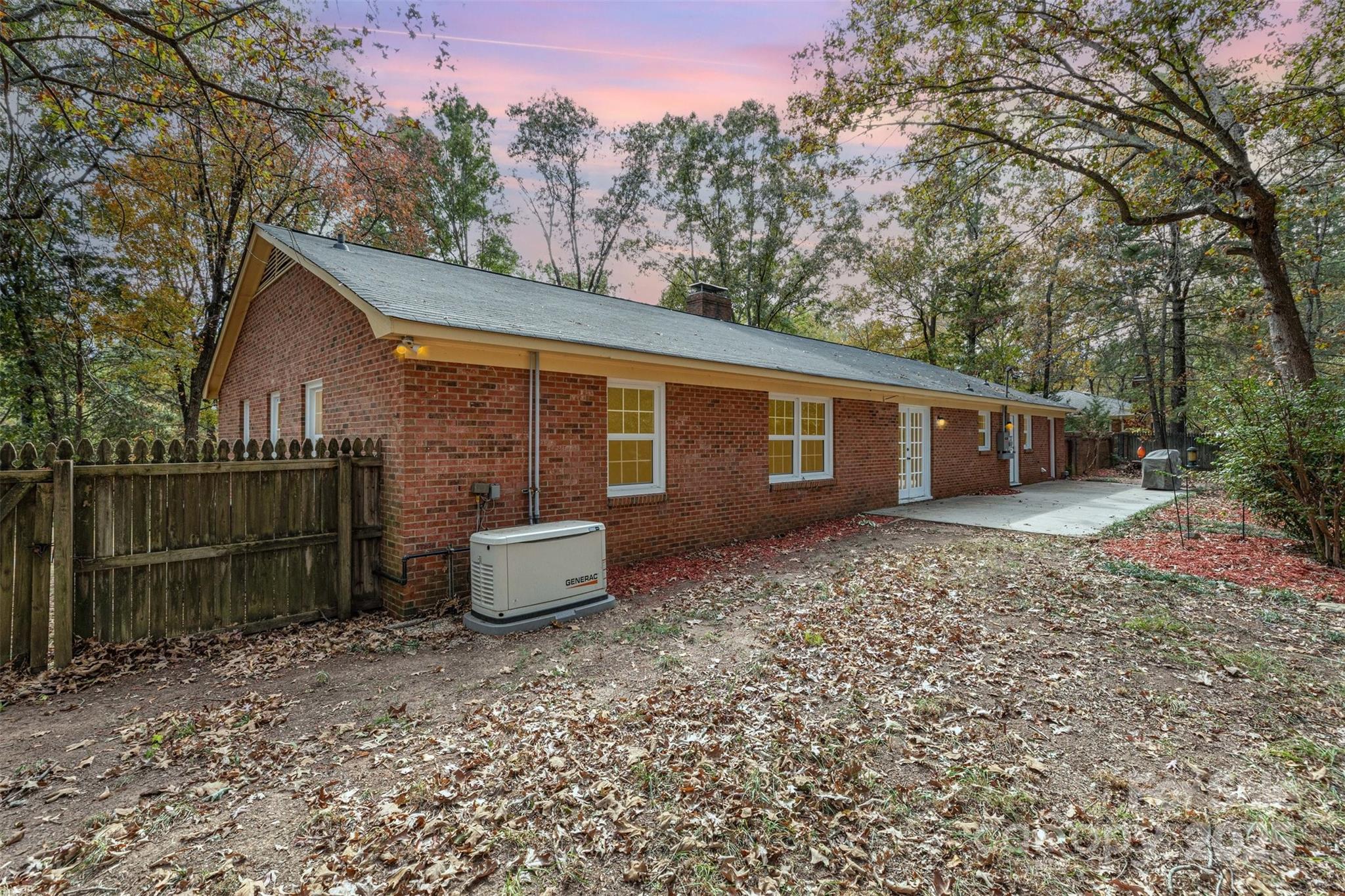 211 Ridgewood Drive Monroe, NC 28112 - Photo 30 of 31 a backyard of a house with lots of green space