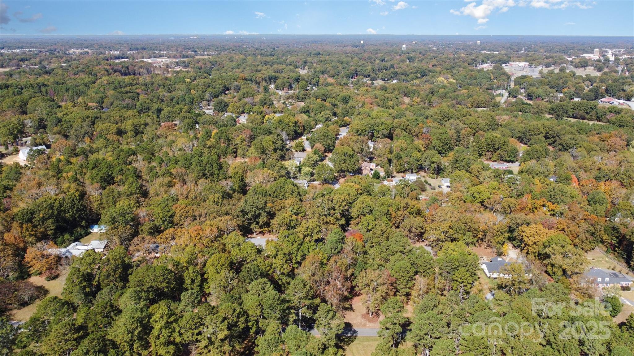 211 Ridgewood Drive Monroe, NC 28112 - Photo 31 of 31 a view of a city with lush green forest