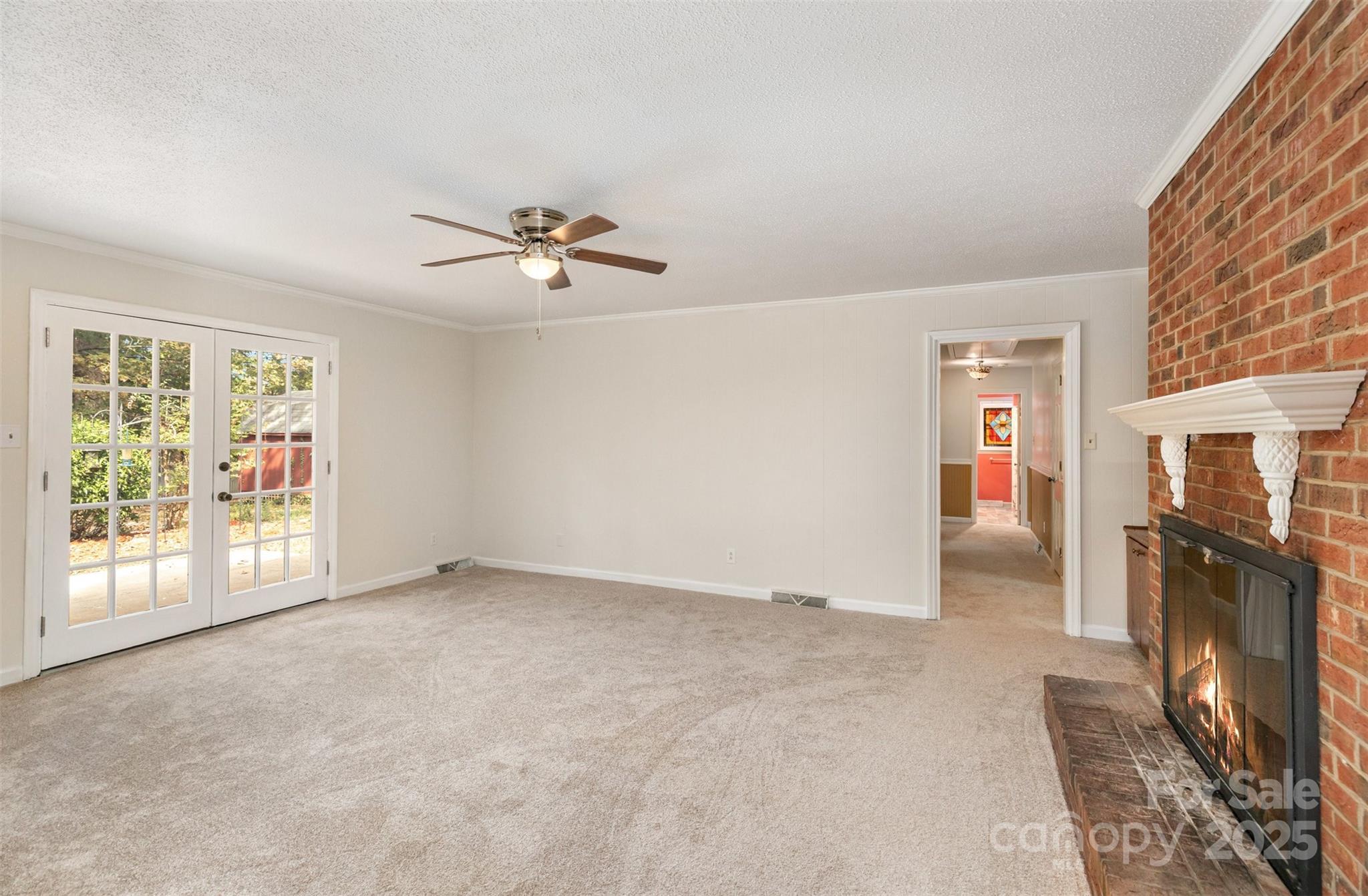 211 Ridgewood Drive Monroe, NC 28112 - Photo 4 of 31 an empty room with windows and fireplace