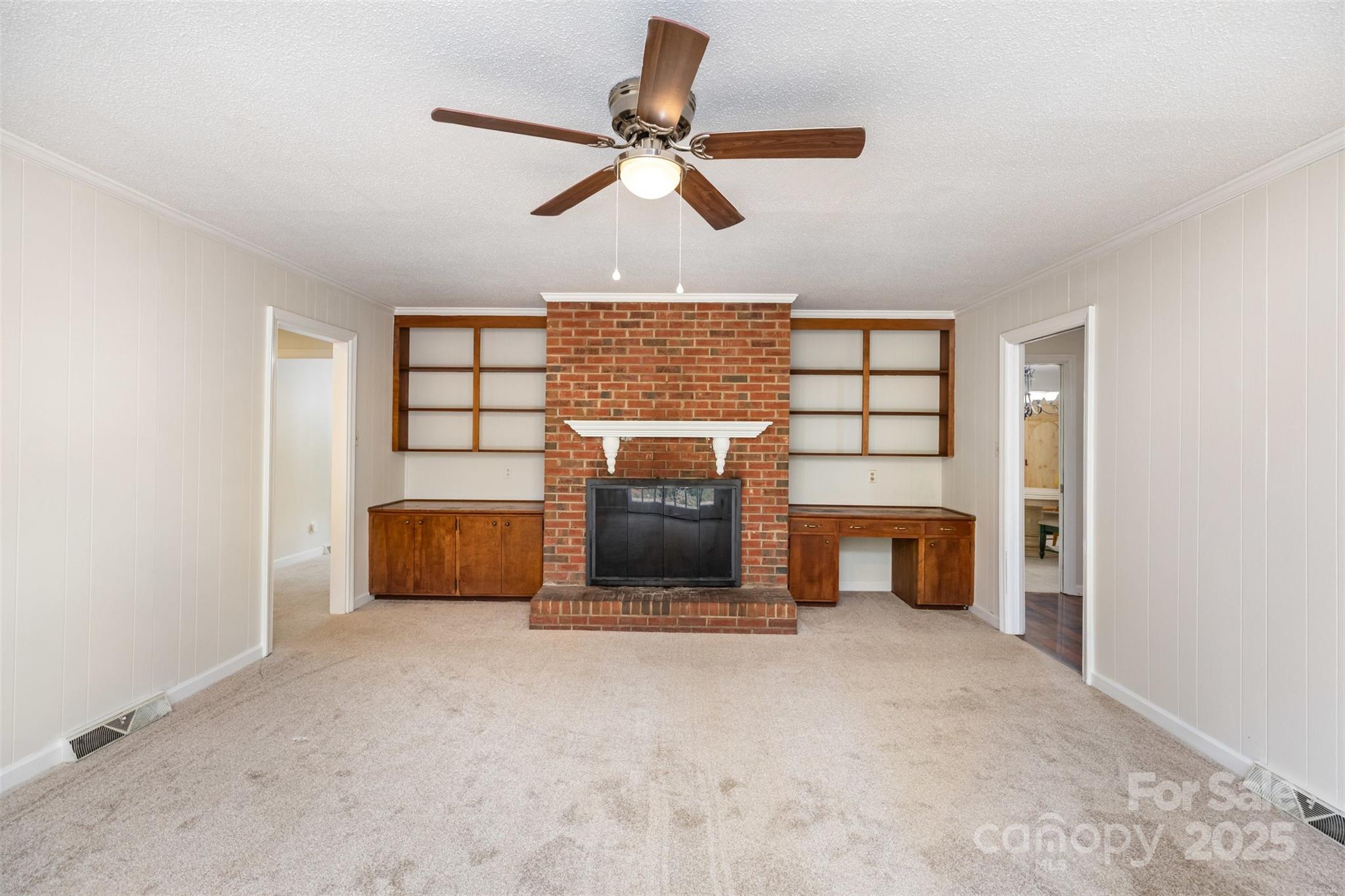 211 Ridgewood Drive Monroe, NC 28112 - Photo 5 of 31 a living room with furniture and a fireplace