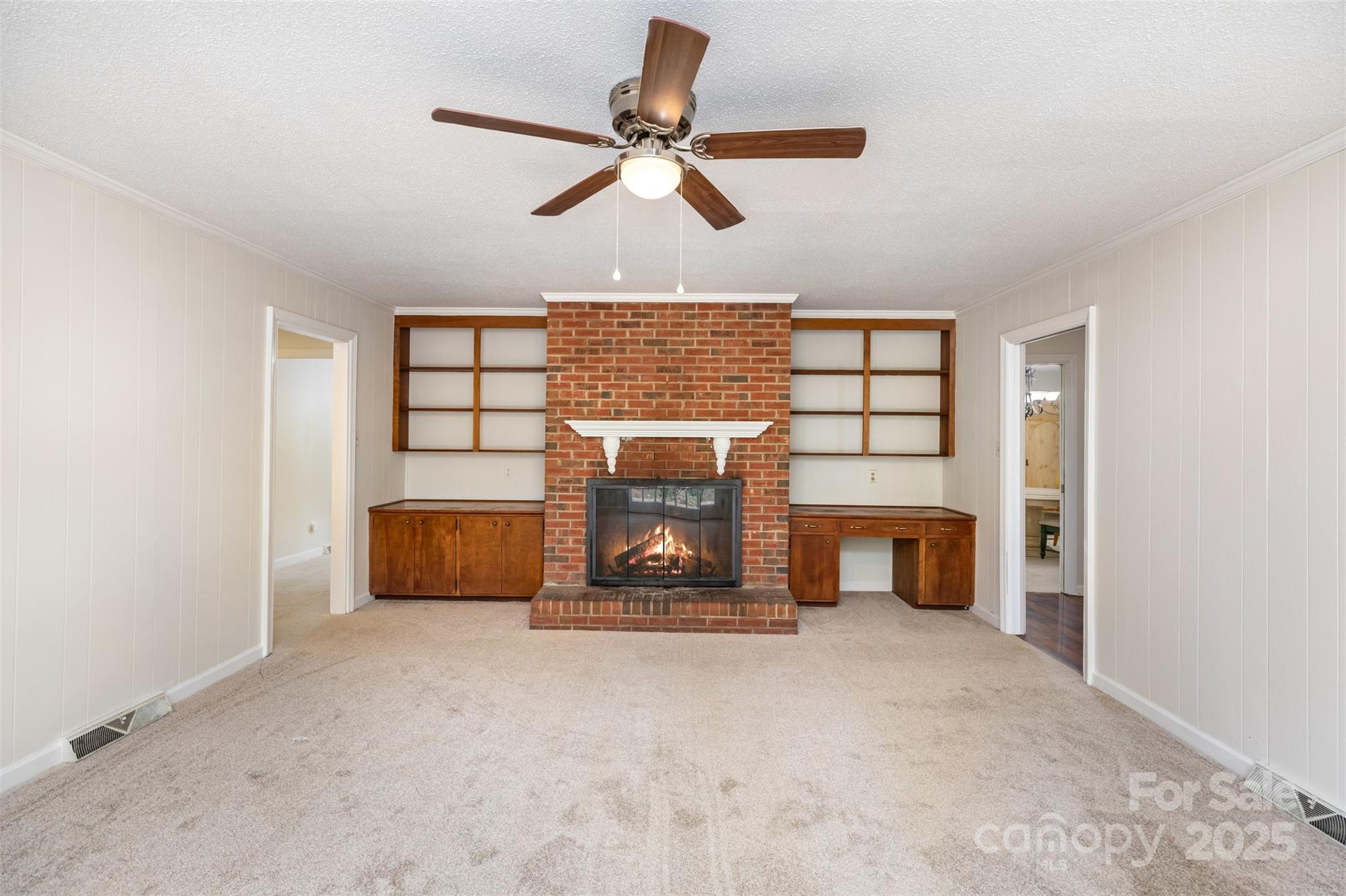 211 Ridgewood Drive Monroe, NC 28112 - Photo 6 of 31 a living room with furniture and a fireplace