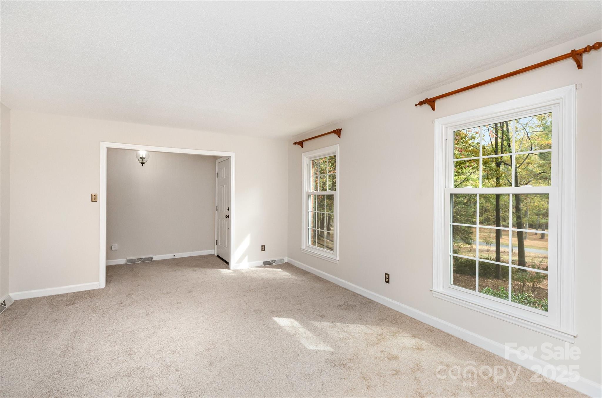 211 Ridgewood Drive Monroe, NC 28112 - Photo 7 of 31 an empty room with windows and closet