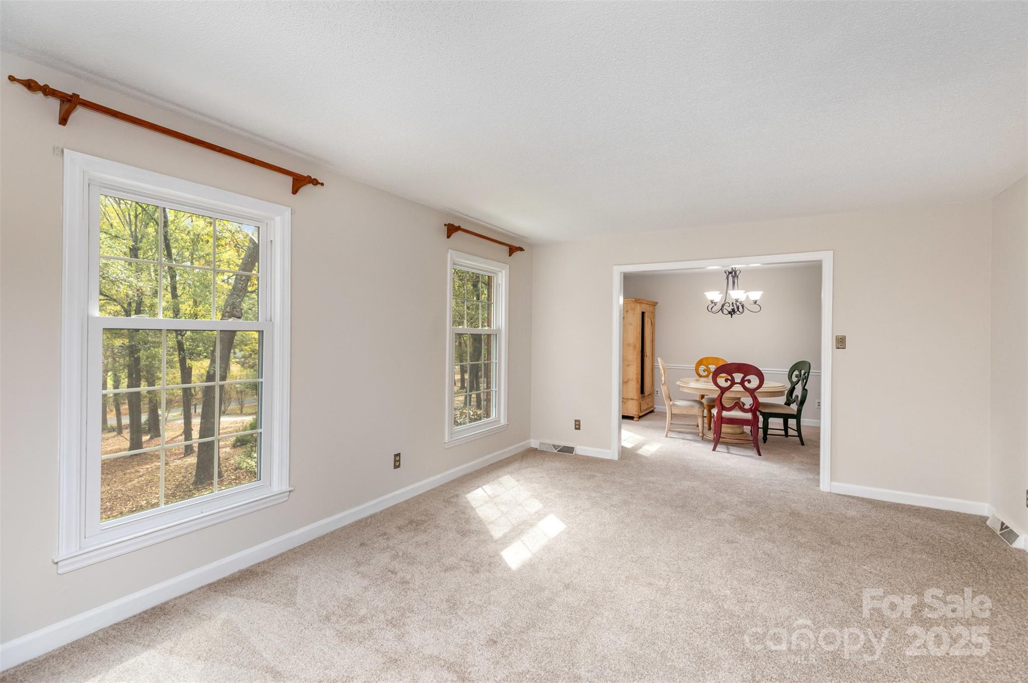 211 Ridgewood Drive Monroe, NC 28112 - Photo 8 of 31 an empty room with furniture and a window