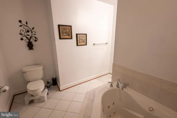 a bathroom with a toilet sink and shower