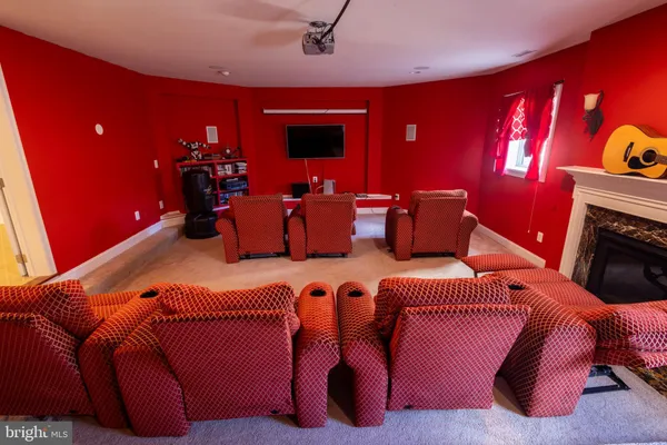 a living room with furniture gym equipment and a flat screen tv