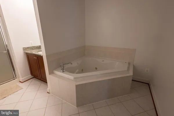 a white bath tub sitting in a bathroom