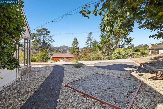 a view of a yard with trees
