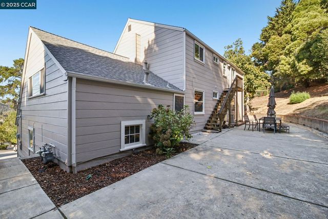 a view of house with backyard