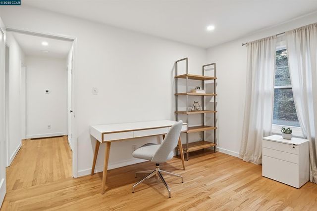 a spacious bedroom with a bed and a window