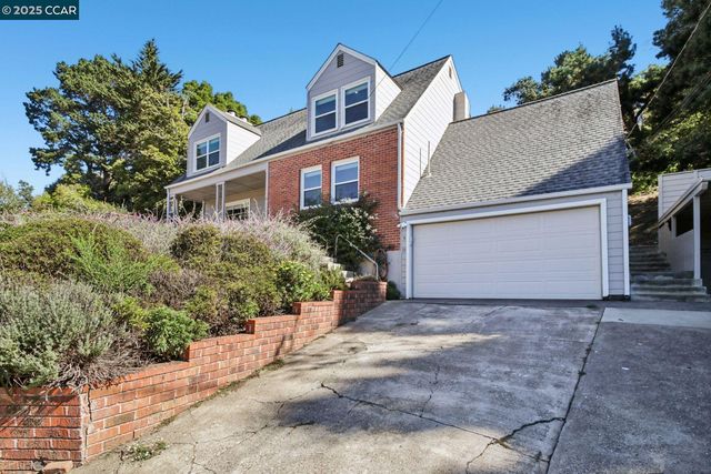a house with trees in the background