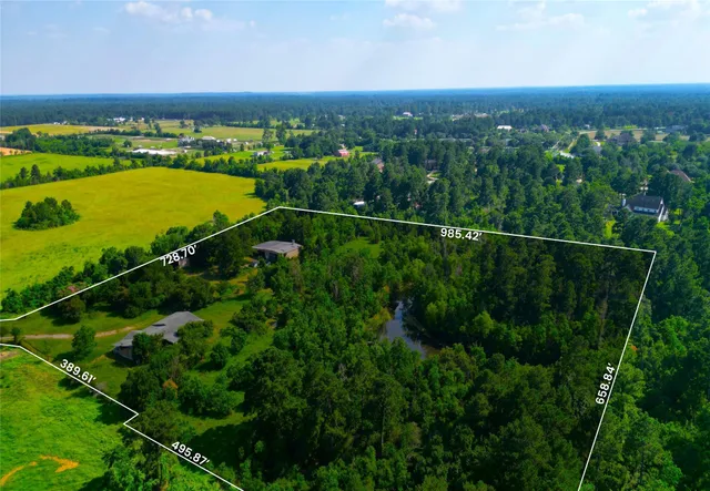 a view of a lake with a yard