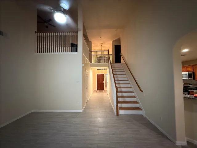 an entryway in a hall with a window