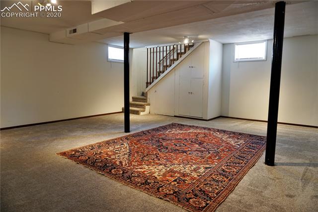 320 West Cheyenne Road Colorado Springs, CO 80906 - Photo 18 of 18 The addition at the back of the home has a large basement family room with easily removable railing for bringing down furniture.