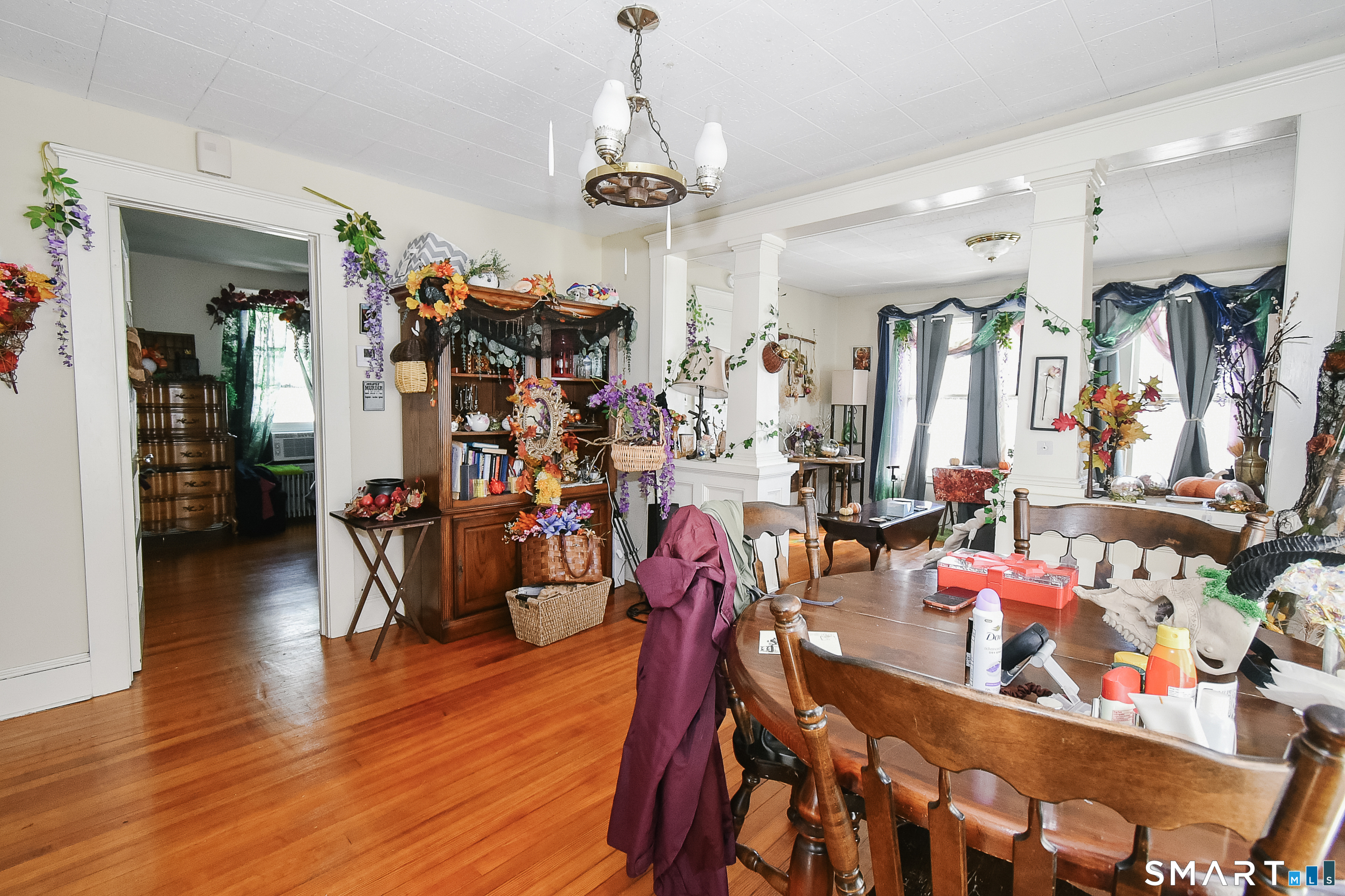 35 School Street Torrington, CT 06790 - Photo 11 of 17 a view of a dining room with lots of furniture wooden floor and chandelier
