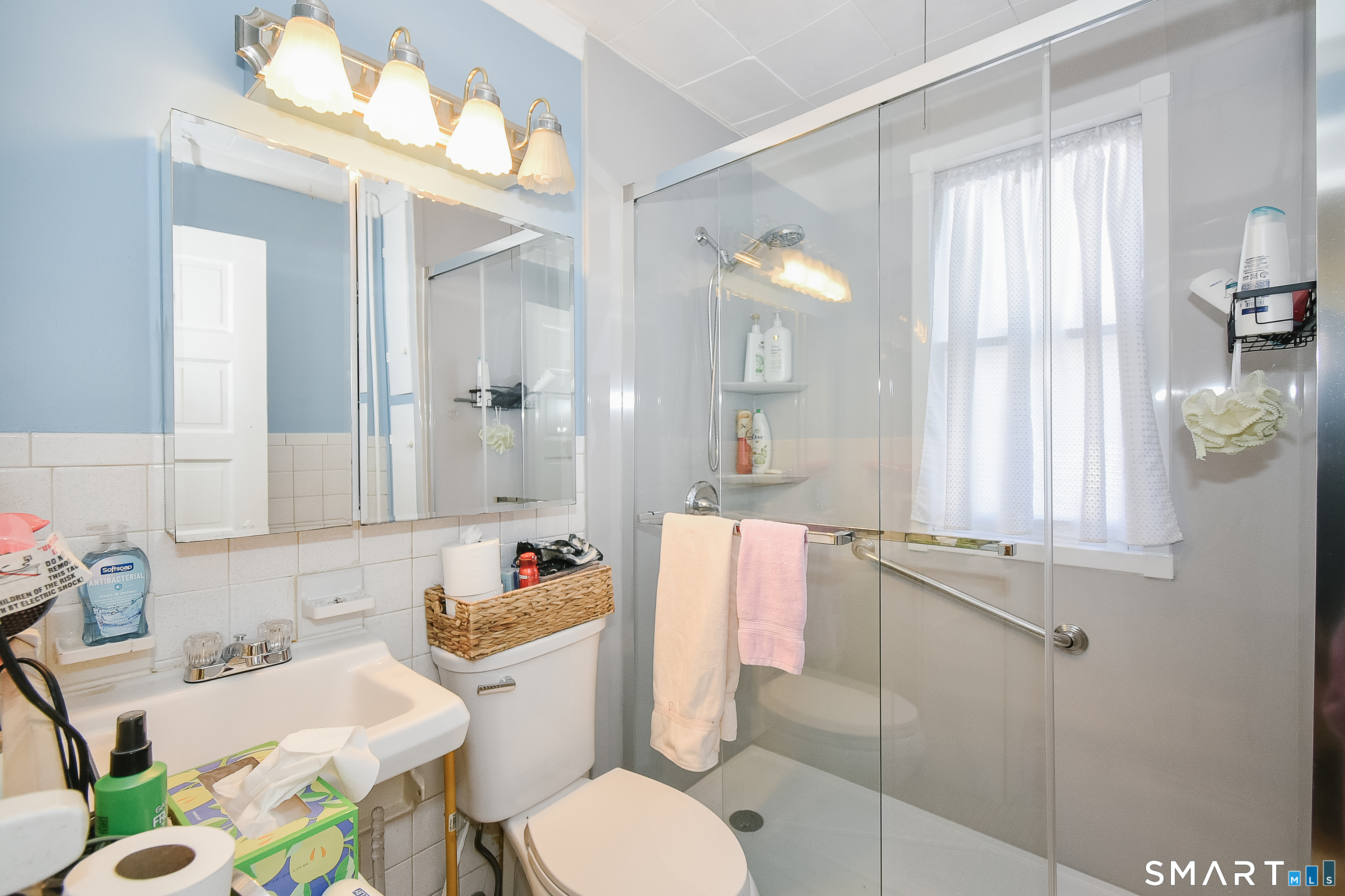 35 School Street Torrington, CT 06790 - Photo 14 of 17 a bathroom with a sink toilet vanity and tub